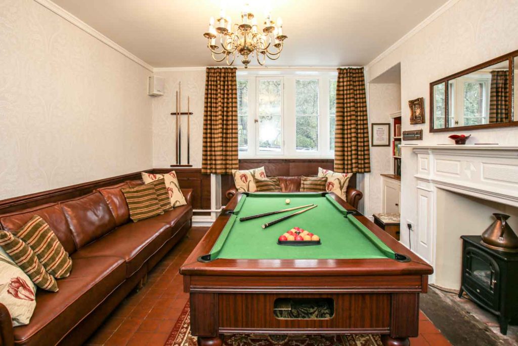 drawing room with a pool table at roaches hall